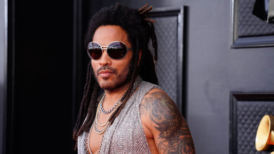 Lenny Kravitz wearing custom VVS diamond grillz by Dolly Cohen at the 2023 CFDA Awards, combining high fashion with handcrafted luxury jewelry.