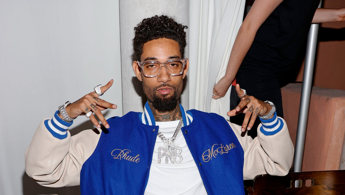 PnB Rock wearing a custom diamond Cuban link chain before his fatal 2022 robbery, which sparked safety changes across the jewelry industry.