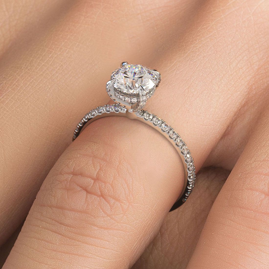 Round hidden halo diamond engagement ring setting shown on hand, with petite micropavé band and eagle prongs in 18k white gold (0.36ctw) | Elegant basket head design from Global Sky Diamonds – Mazalito bridal luxury in NYC’s Diamond District | globalskydiamond.com