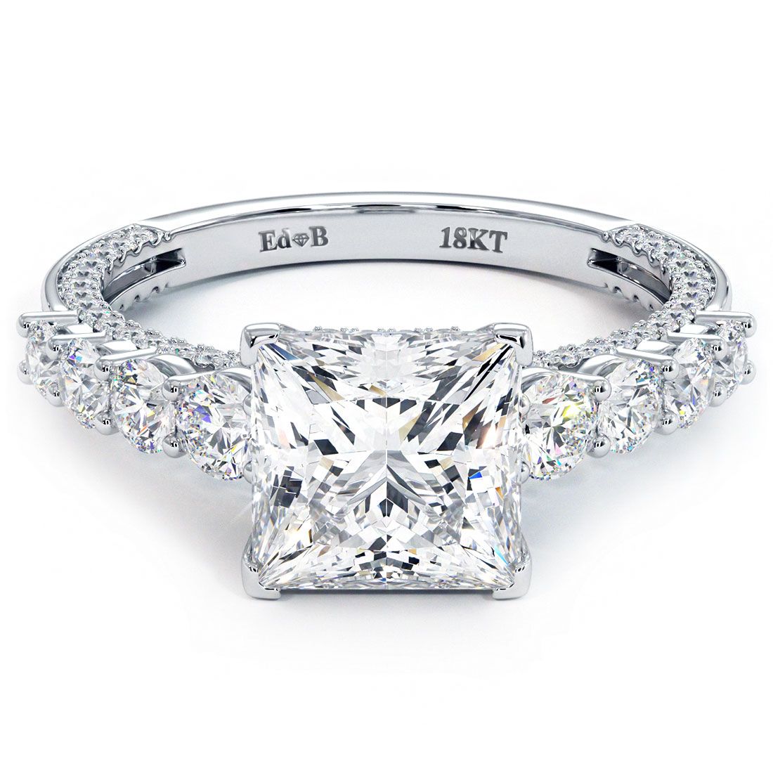 op-down view of Round Brilliant Infinity Twist Halo engagement ring setting with 0.77ctw G color SI1 clarity micropavé side diamonds in 18k white gold, designed for a 1.0ct round center stone (not included), showcasing a delicate twisted shank and halo design, photographed at Global Sky Diamonds, 44W 47th St Booth GF-10, Diamond District NYC. Discover more at GlobalSkyDiamond.com.