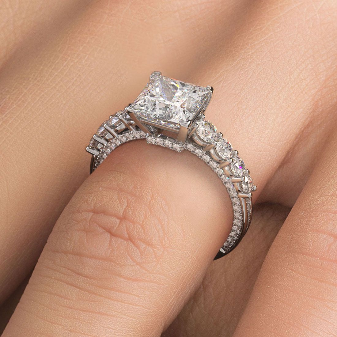 Elegant on-hand image of Infinity Twist Round Halo diamond ring setting in 18k white gold with 0.77ctw micropavé G SI1 diamonds, crafted to hold a 1.0ct round center stone (not included), highlighting brilliance and feminine design from Global Sky Diamonds, located at 44W 47th St Booth GF-10, Diamond District NYC. Visit GlobalSkyDiamond.com to view.