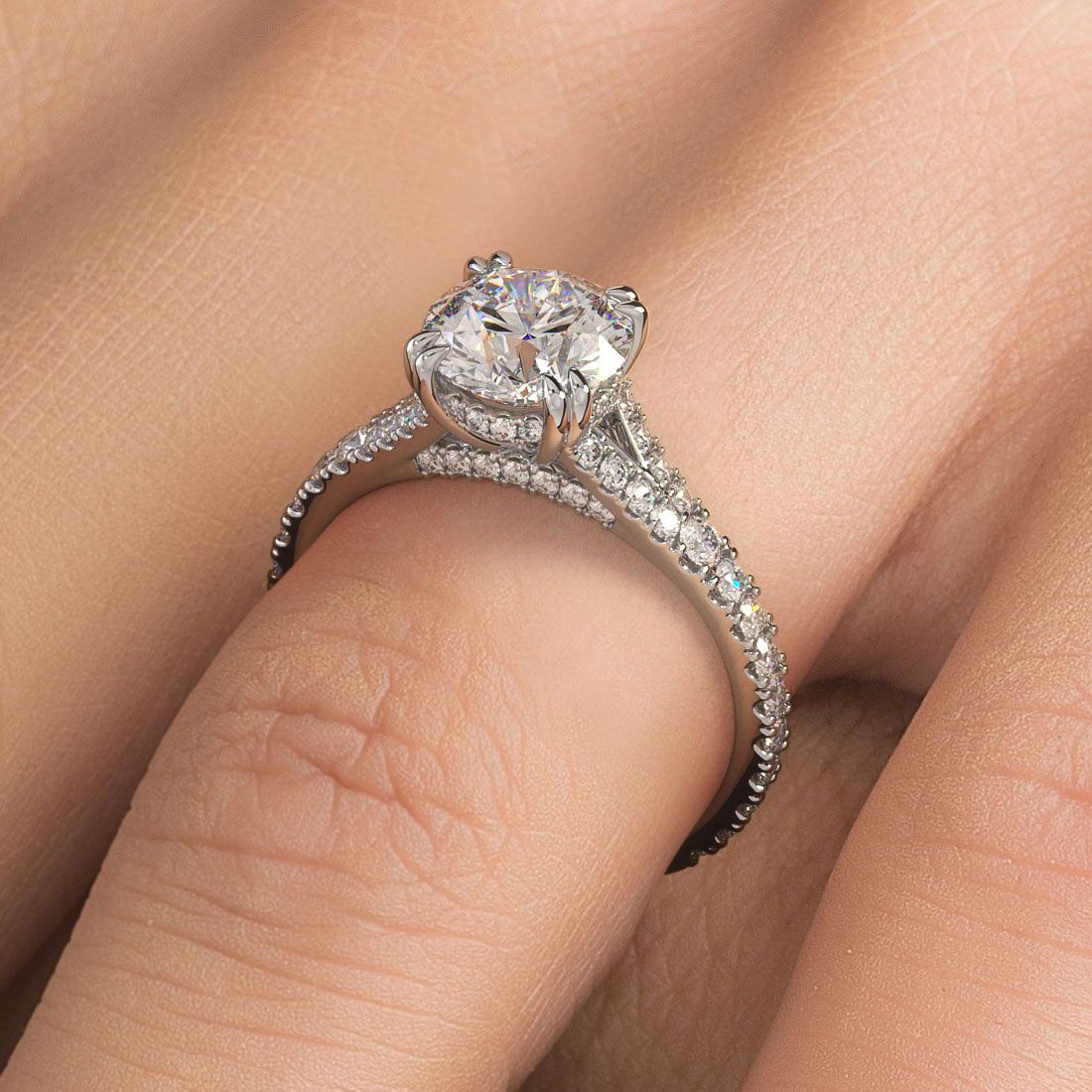 Round Brilliant diamond engagement ring in 18k white gold worn on hand, highlighting elegant infinity twist design, micropavé diamond band, and stunning craftsmanship from Global Sky Diamonds, located in Manhattan’s Diamond District at 44W 47th St Booth GF-10. Browse more bridal jewelry styles at globalskydiamond.com.