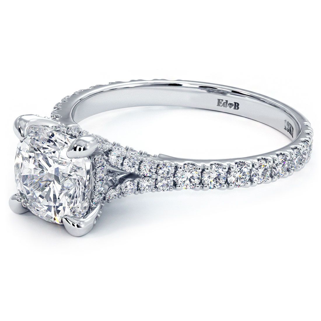 Angled close-up of Cushion Cut Cathedral Split Shank Engagement Ring Setting in 18k white gold with pavé-set G SI1 side diamonds (0.60ctw), designed for a 1.50ct cushion center stone. Unique blend of vintage and modern aesthetics from Global Sky Diamonds in New York’s Diamond District, 44W 47th St Booth GF-10. View this elegant bridal ring at globalskydiamond.com.
