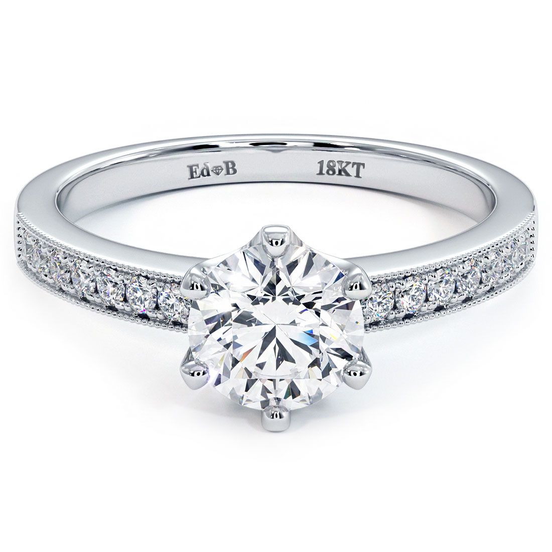 Close-up view of a round brilliant 6-prong micropavé milgrain diamond engagement ring setting in 18k white gold, featuring G color SI1 clarity side stones totaling 0.16 carats, showcased by Global Sky Diamonds, Diamond District NYC, 44W 47th St Booth GF-10. Center diamond not included. Ideal for a 1.0ct round center stone. Shop now at globalskydiamond.com