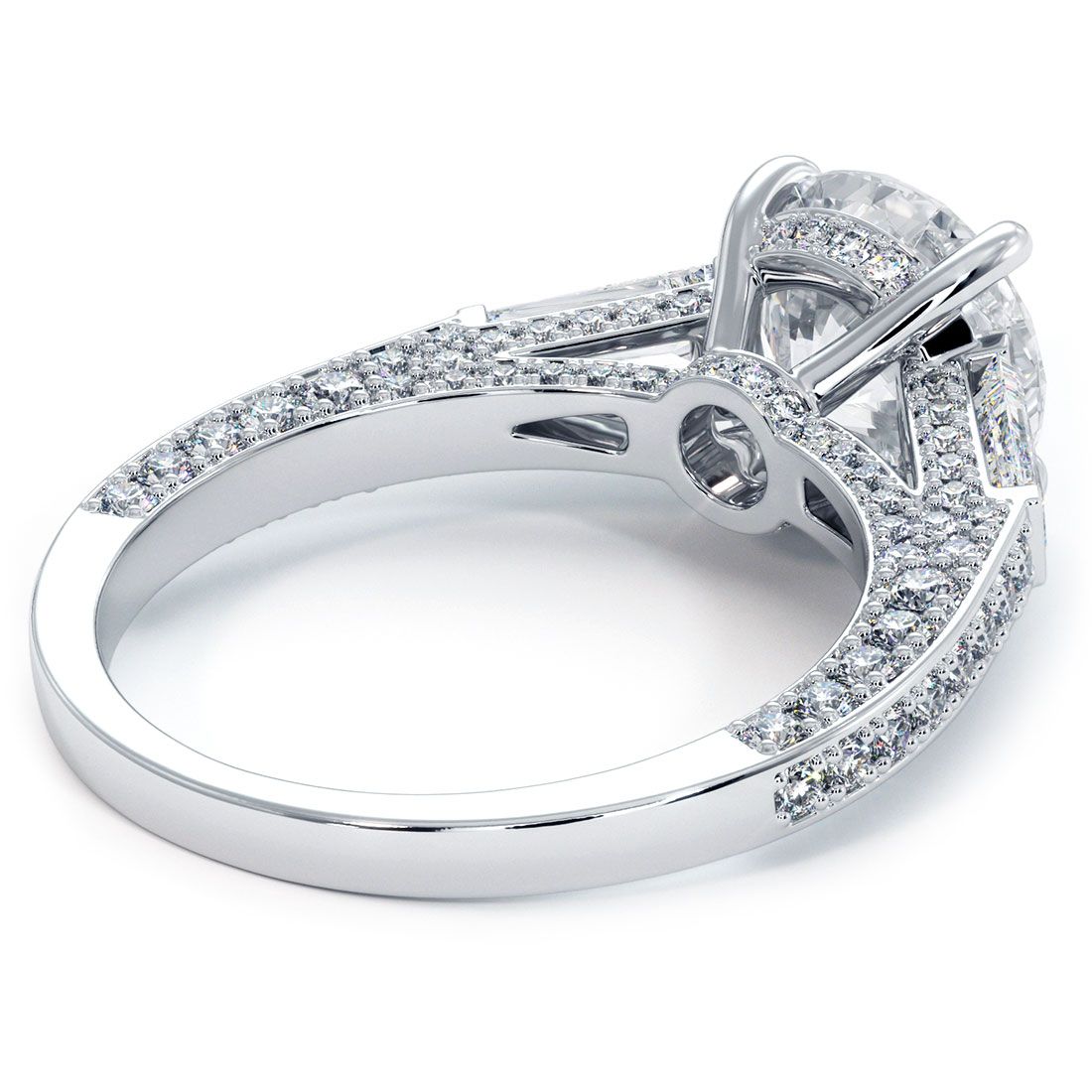 Underside view of luxurious micropavé three-stone engagement ring setting with round and tapered baguette diamonds, handcrafted in 18k white gold, available at Global Sky Diamonds, 44W 47th St GF-10, globalskydiamond.com