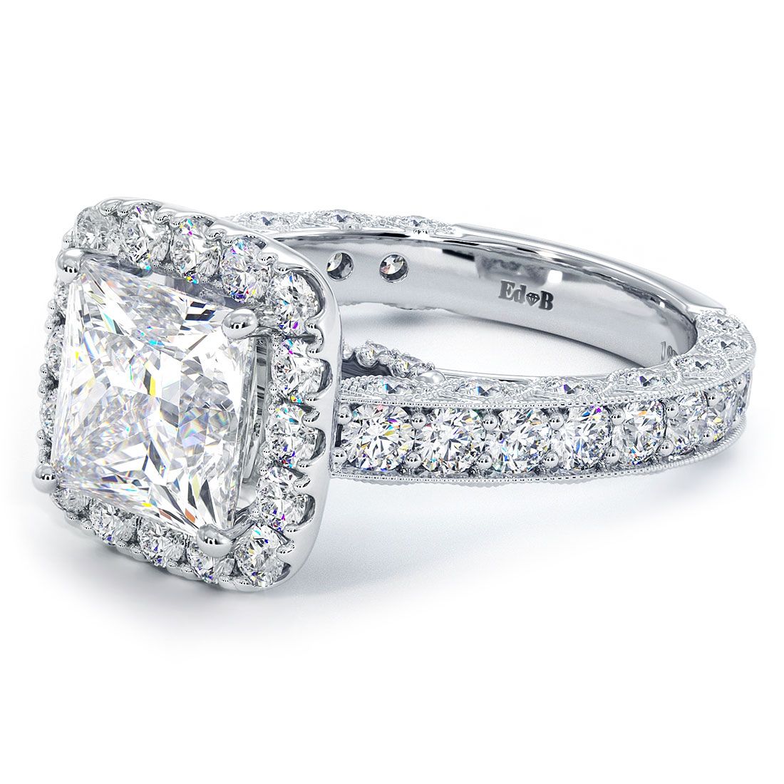 Close-up of cushion halo ring with vintage filigree and princess cut center (not included). 18K white gold setting features 1.90ctw micropavé side diamonds, G color, SI1 clarity. Classic antique details in a modern engagement ring. Global Sky Diamonds, 44W 47th St GF-10, NYC Diamond District. globalskydiamond.com @globalskydiamonds @global.sky.diamond