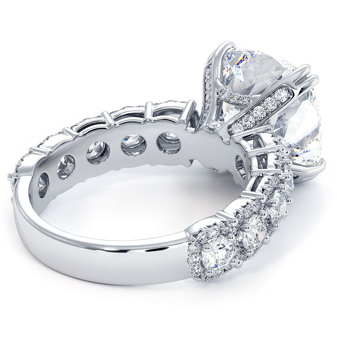 Angled view of cushion cut micropavé halo diamond engagement ring setting, showcasing intricate 18k white gold craftsmanship with 1.25ctw side diamonds, G color, SI1 clarity. Designed for a 5.0ct cushion center. Available at Global Sky Diamonds, 44W 47th St Booth GF-10, Diamond District NYC. Visit globalskydiamond.com