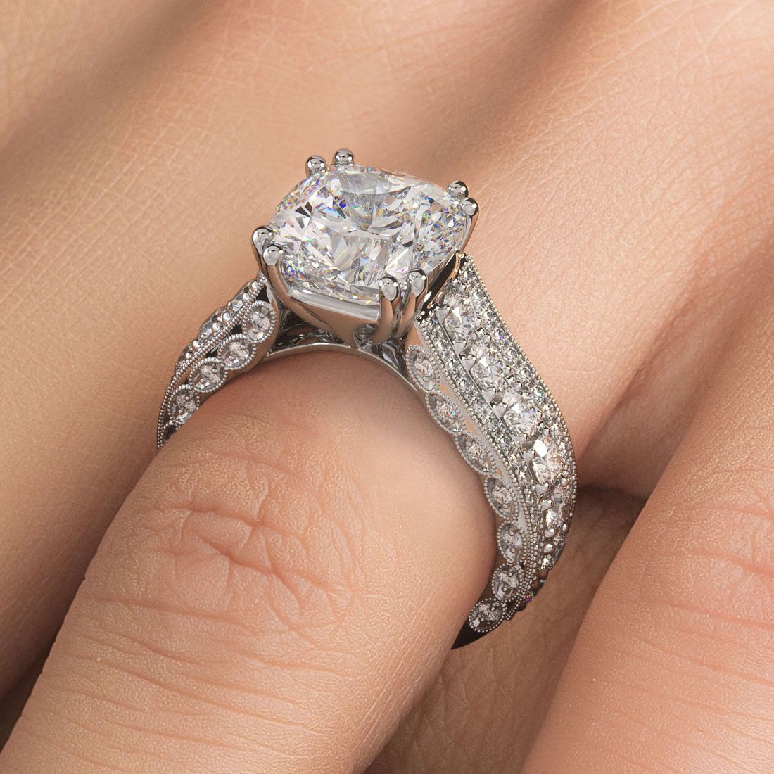 Elegant cushion cut vintage diamond engagement ring setting on hand, showcasing brilliant pave-set side stones with G color and SI1 clarity, handcrafted in 18K white gold with intricate milgrain and split shank design. Available exclusively from Global Sky Diamond, 44 W 47th St Booth GF-10, Diamond District NYC. Explore more at www.globalskydiamond.com.