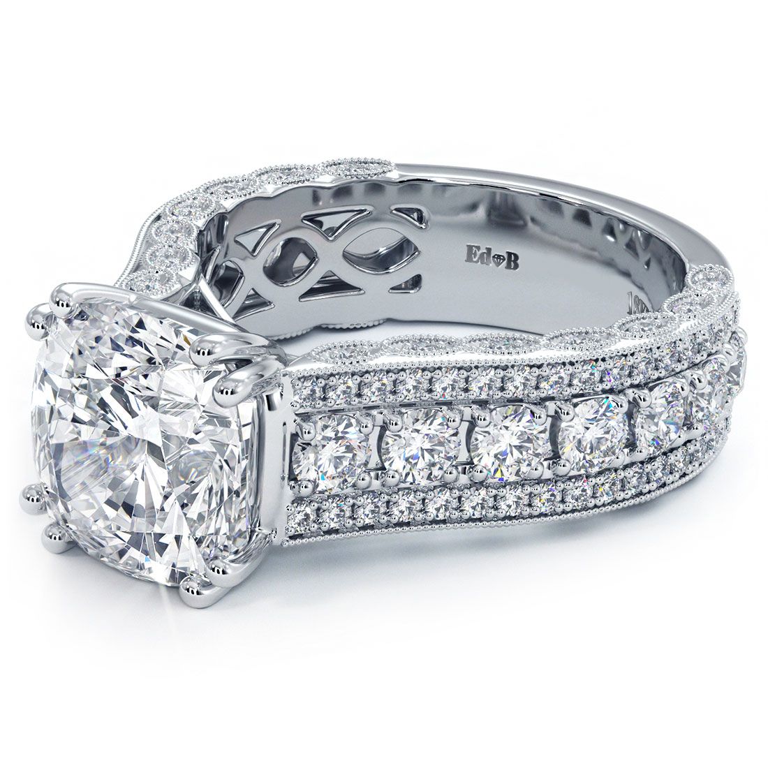Close-up angle of cushion cut vintage-inspired diamond ring setting with rows of G color SI1 clarity diamonds and detailed engraving in solid 18K white gold. This engagement ring showcases exquisite craftsmanship from Global Sky Diamond, 44 W 47th St Booth GF-10 in NYC’s Diamond District. Browse www.globalskydiamond.com for more.