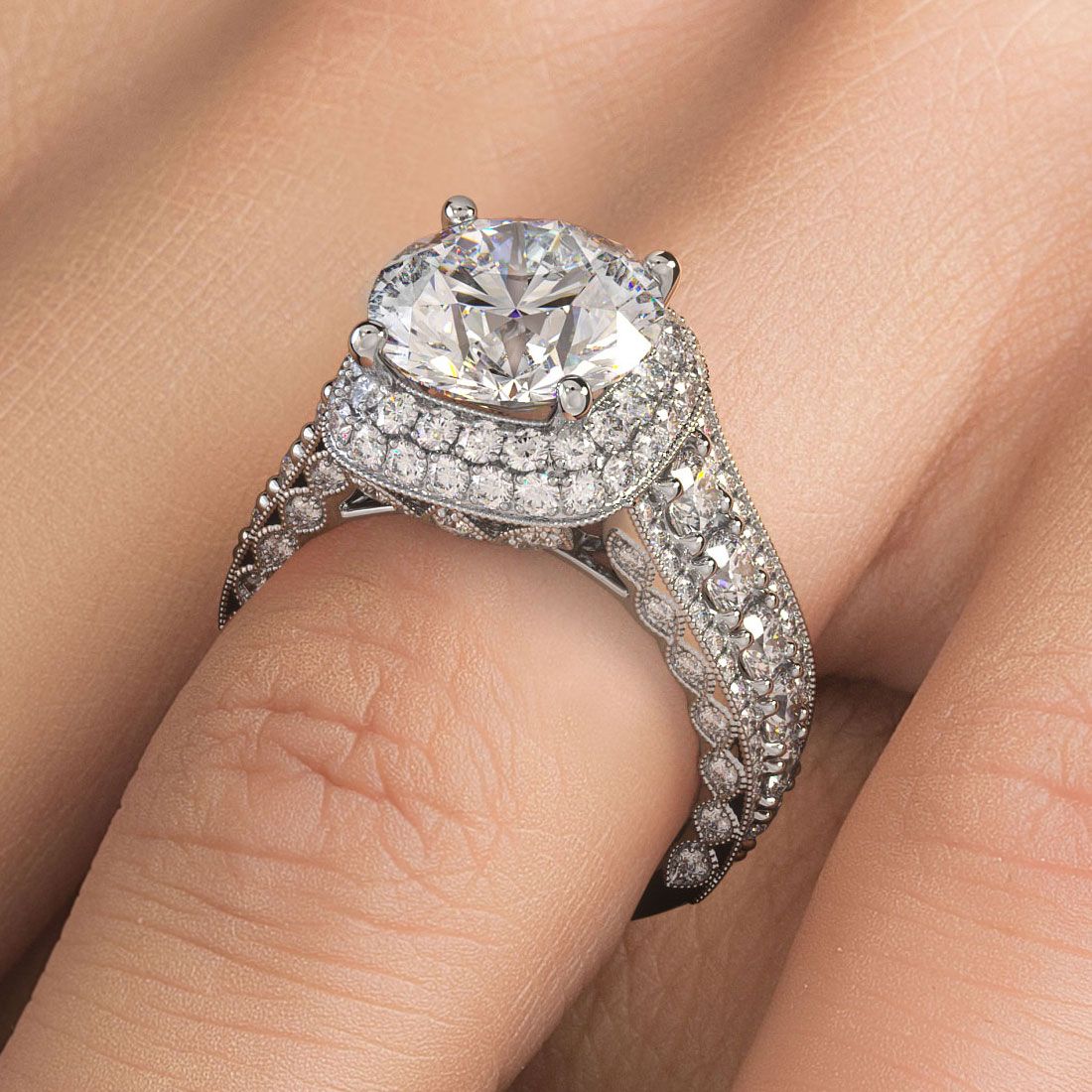 Close-up hand shot of elegant round center cushion halo diamond engagement ring in vintage 18k white gold with micropavé diamonds and intricate shank detailing from Global Sky Diamond, 44 W 47th St Booth GF-10 NYC, ideal for proposals and luxury jewelry gifts, globalskydiamond.com