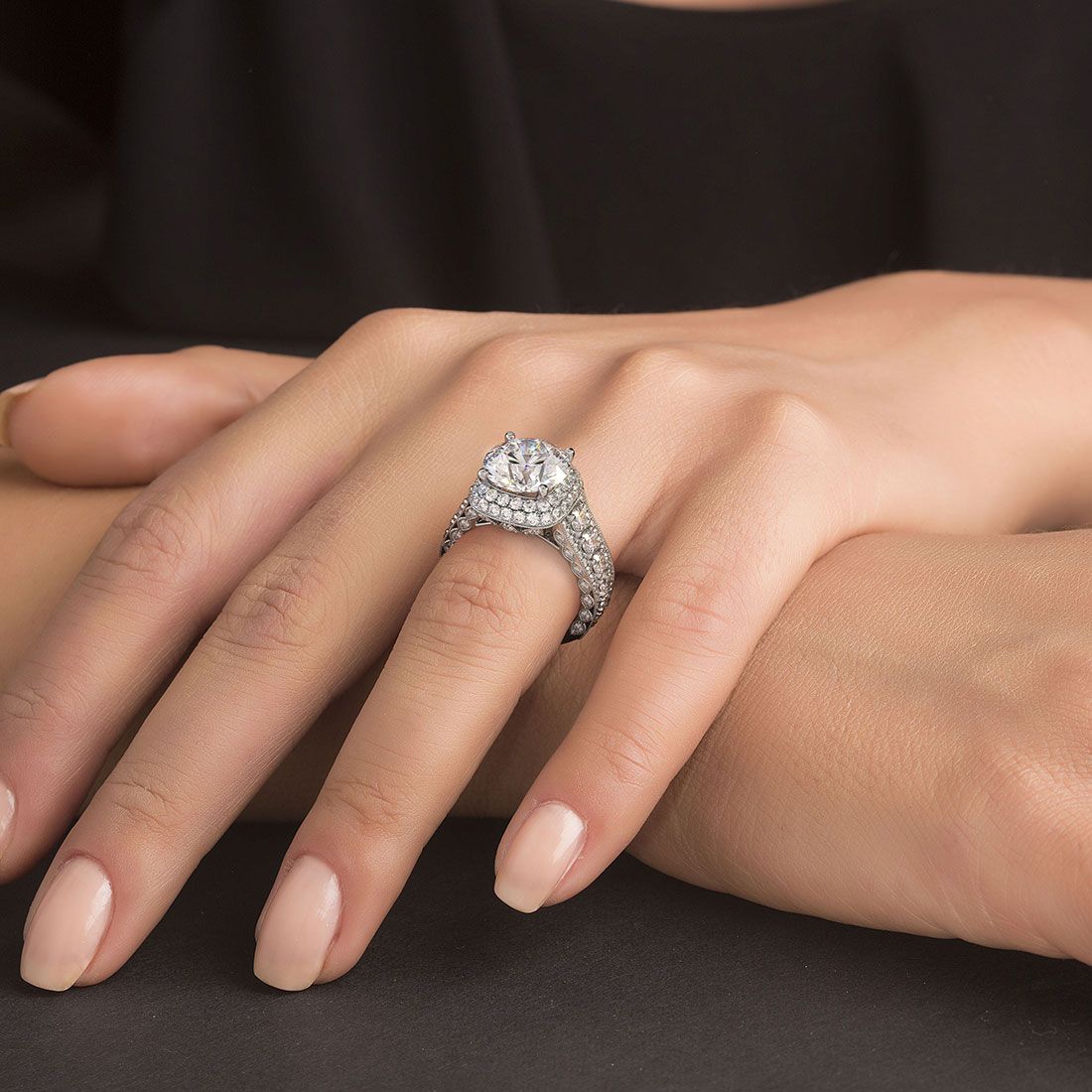 Model wearing cushion halo engagement ring with round 3.50ct center stone setting and graduated shank diamond band in 18k white gold, vintage inspired micropavé design, handcrafted in NYC’s Diamond District by Global Sky Diamond, 44 W 47th St Booth GF-10, globalskydiamond.com