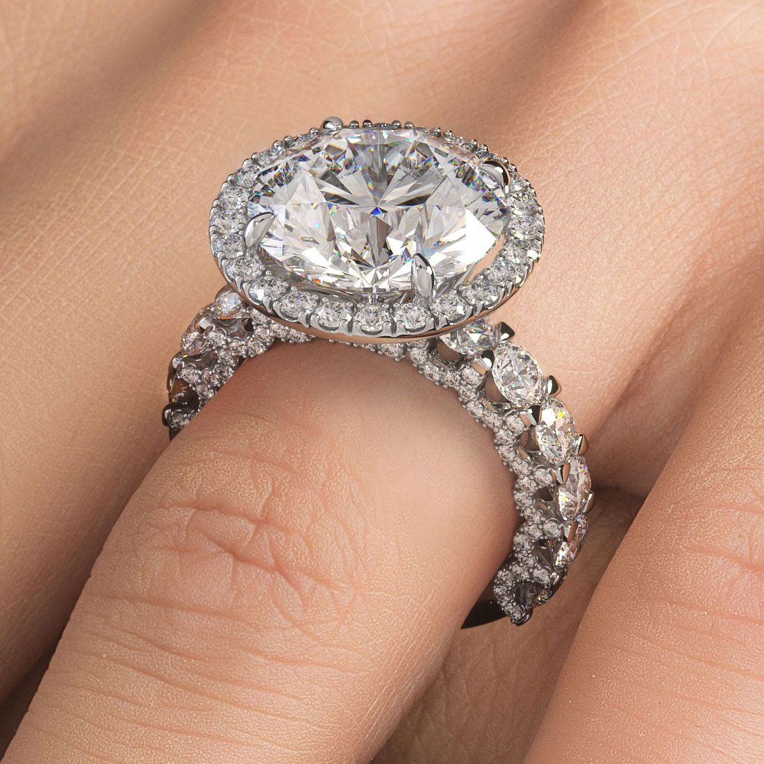 On-hand view showcasing the brilliance of the round halo micropavé diamond engagement ring setting with a U-shape split shank design in 18k white gold, featuring 3.45ctw of sparkling G color SI1 clarity side diamonds, designed to hold a 7.40ct round center diamond (not included) — available exclusively from Global Sky Diamond, 44 W 47th St Booth GF-10, NYC Diamond District — visit globalskydiamond.com for details.