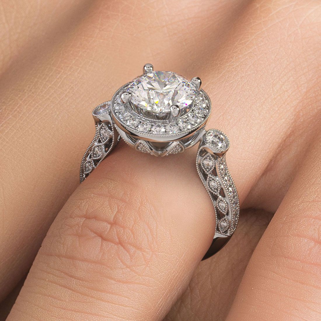 Detailed close-up of round halo vintage-style engagement ring setting with 1.05 carats of high-quality G/SI1 side diamonds, ornate filigree work, antique milgrain edging, and 18k white gold band, created for a 2.0ct round center diamond (not included), custom designed by Global Sky Diamond at 44 W 47th St Booth GF-10 in New York's Diamond District — browse fine jewelry at globalskydiamond.com.