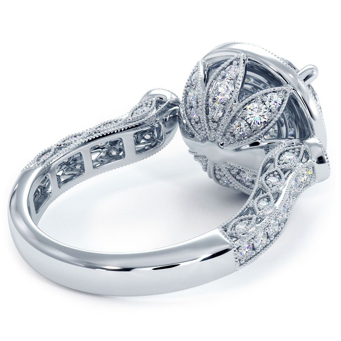 Artistic close-up showcasing the filigree scrollwork, milgrain accents, and micropavé G color SI1 clarity side diamonds (1.05ctw) on this 18k white gold round halo engagement ring setting made to house a 2.0ct round center diamond (not included), available from Global Sky Diamond at 44 W 47th St Booth GF-10 in NYC’s Diamond District — full vintage collection at globalskydiamond.com.