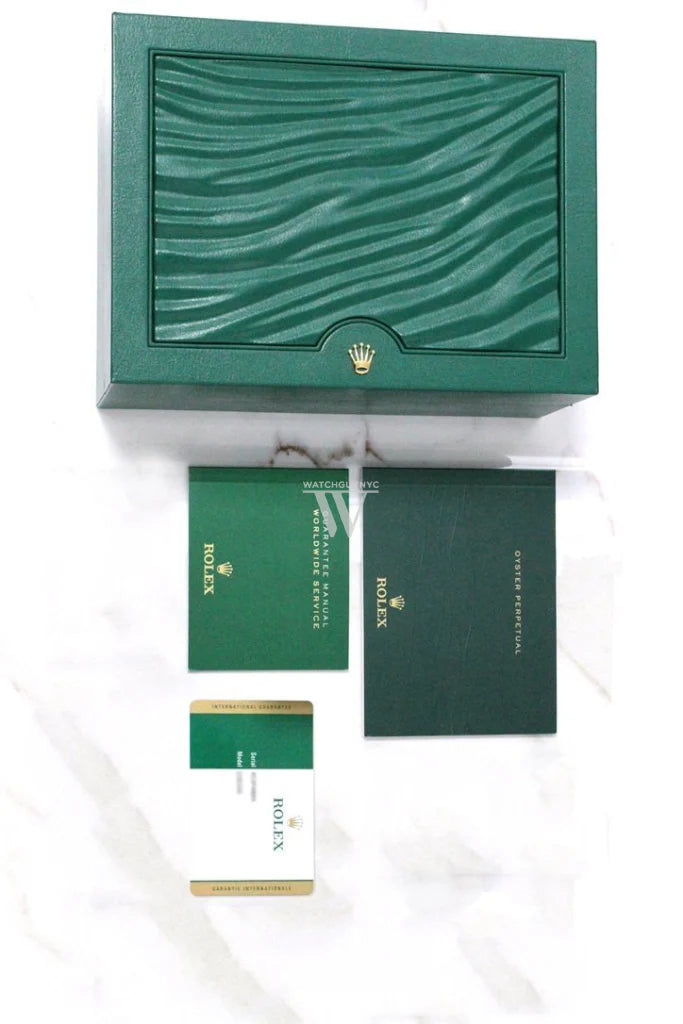 Complete Rolex Day-Date 36 packaging with original green Rolex box, warranty card, and manuals — shop authentic luxury watches at globalskydiamonds.com