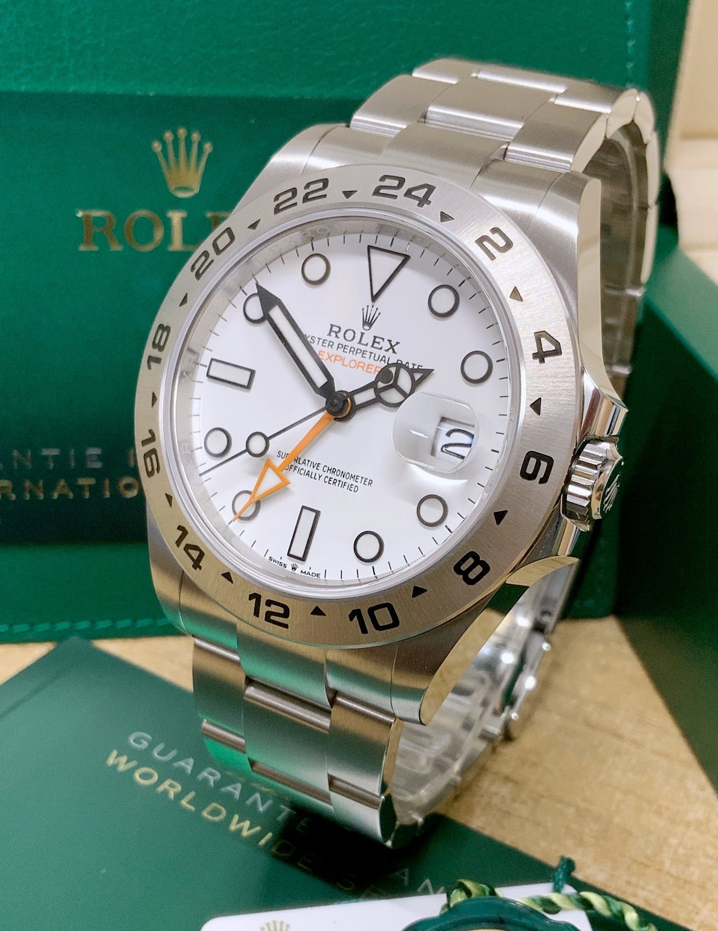 Rolex Explorer II 42mm Polar White Dial Men's Watch 226570 with Oystersteel case and Oyster bracelet, fixed engraved 24-hour bezel, orange GMT hand, Chromalight luminous markers, sapphire crystal with Cyclops lens, automatic Caliber 3285 movement, and Oysterlock clasp—never worn, 100% authentic with original Rolex box and warranty card, available now at Global Sky Diamonds in New York City’s Diamond District at 44 W 47th St Booth GF-10. 3-year warranty included. Shop at globalskydiamond.com.
