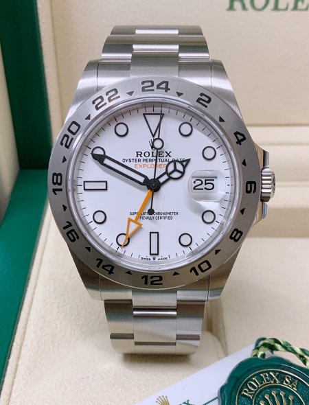 Rolex Explorer II 42mm Polar White Dial Men's Watch 226570 with Oystersteel case and Oyster bracelet, fixed engraved 24-hour bezel, orange GMT hand, Chromalight luminous markers, sapphire crystal with Cyclops lens, automatic Caliber 3285 movement, and Oysterlock clasp—never worn, 100% authentic with original Rolex box and warranty card, available now at Global Sky Diamonds in New York City’s Diamond District at 44 W 47th St Booth GF-10. 3-year warranty included. Shop at globalskydiamond.com.