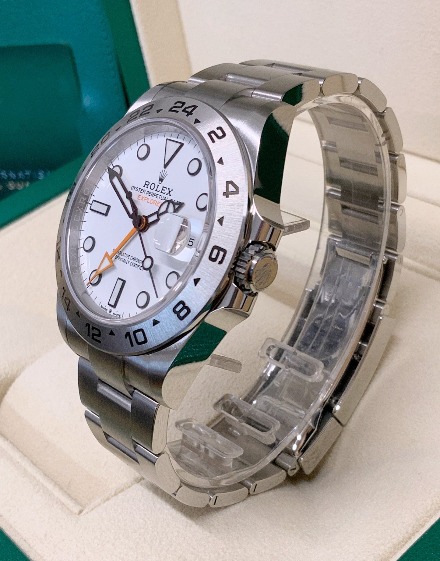 Rolex Explorer II 42mm Polar White Dial Men's Watch 226570 with Oystersteel case and Oyster bracelet, fixed engraved 24-hour bezel, orange GMT hand, Chromalight luminous markers, sapphire crystal with Cyclops lens, automatic Caliber 3285 movement, and Oysterlock clasp—never worn, 100% authentic with original Rolex box and warranty card, available now at Global Sky Diamonds in New York City’s Diamond District at 44 W 47th St Booth GF-10. 3-year warranty included. Shop at globalskydiamond.com.
