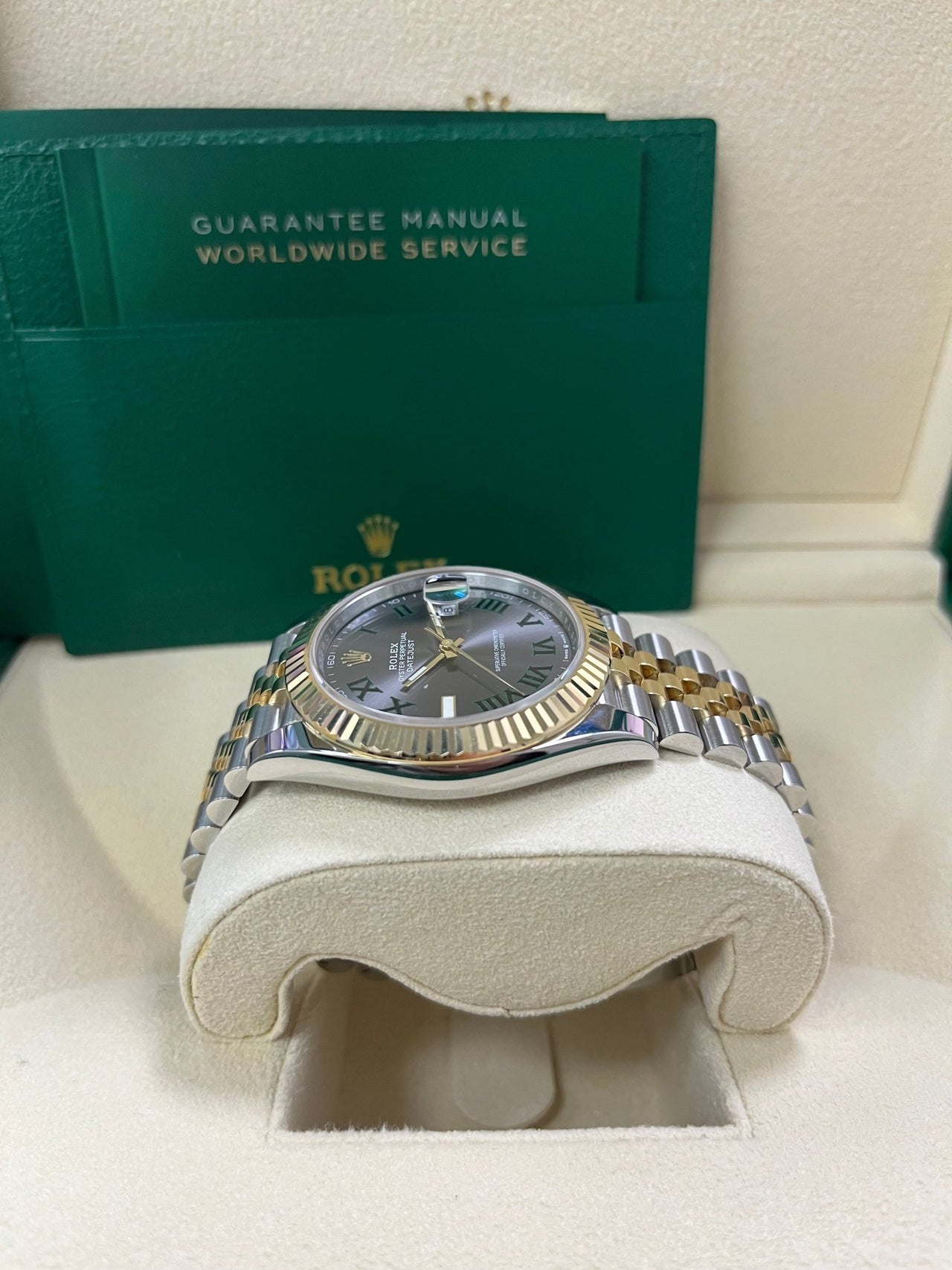 Side profile of Rolex Datejust 126333 showing steel and yellow gold case, fluted bezel, and grey stick dial – 2025 pre-owned Rolex watch full set from Global Sky Diamonds – globalskydiamond.com