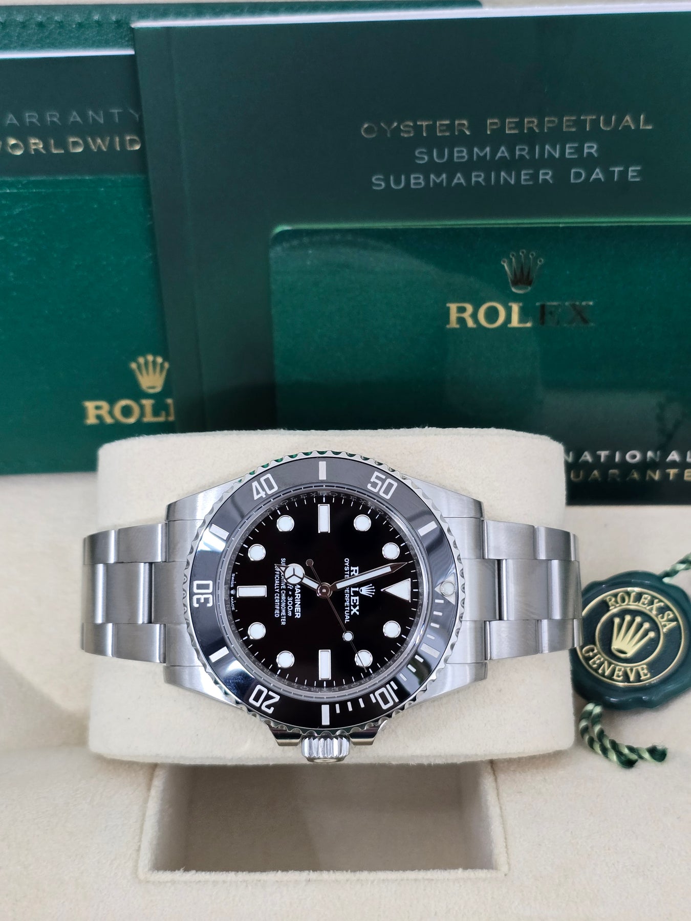 Side profile of Rolex 114060 Submariner showing stainless steel case, no-date dial, and Glidelock clasp – full set with box and appraisal papers at Global Sky Diamonds – globalskydiamond.com