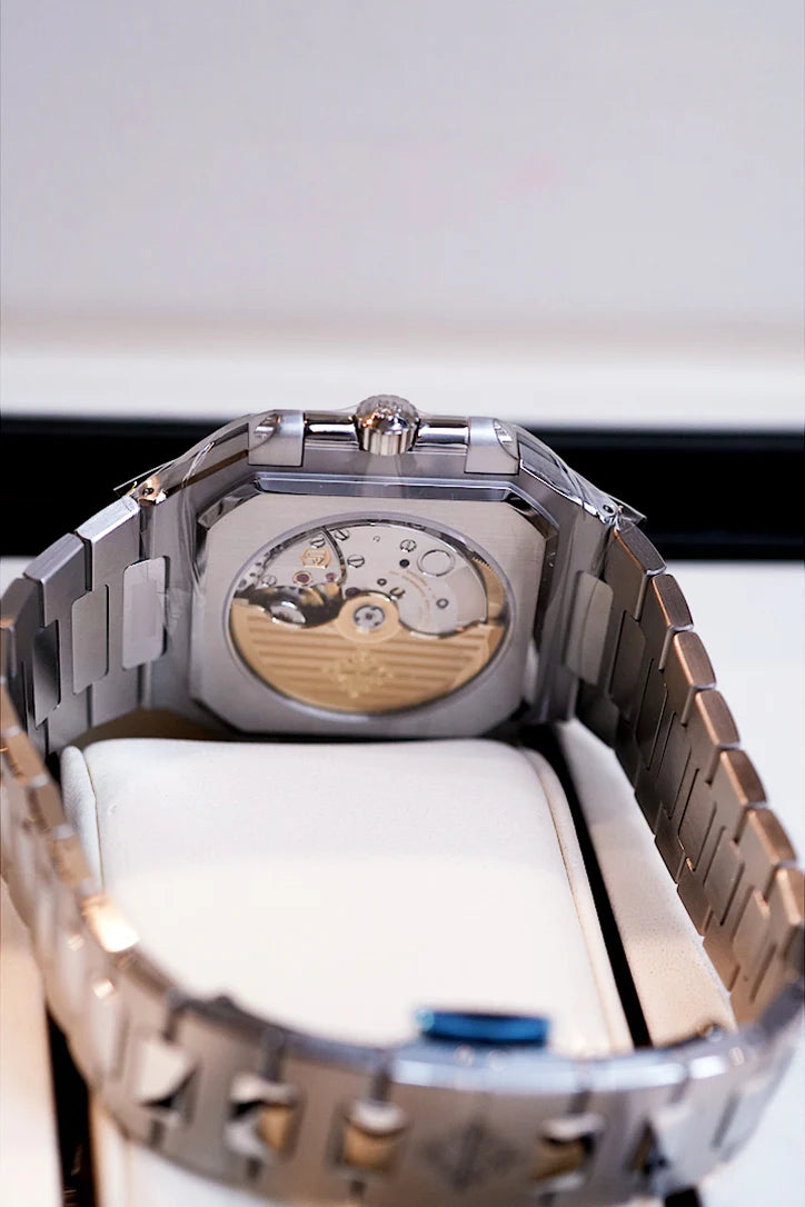 Angled close-up of Patek Philippe Cubitus 5821/1A olive green stainless steel watch bezel and dial – Shop luxury watches at Global Sky Diamonds | GlobalSkyDiamond.com