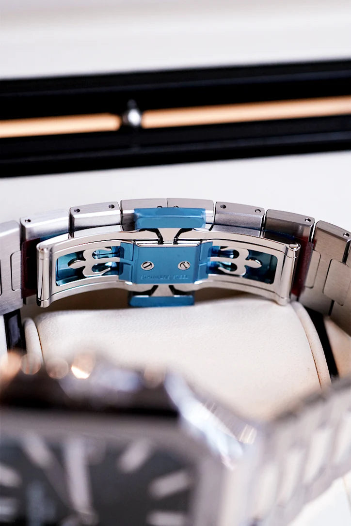 Brushed stainless steel bracelet and olive green dial of Patek Philippe Cubitus 5821/1A shown under natural light – Global Sky Diamonds NYC | GlobalSkyDiamond.com