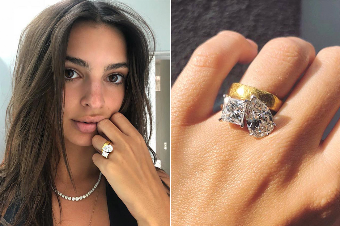 Emily Ratajkowski wearing a custom two-stone Toi et Moi engagement ring with pear and princess-cut diamonds, designed in NYC’s Diamond District.
