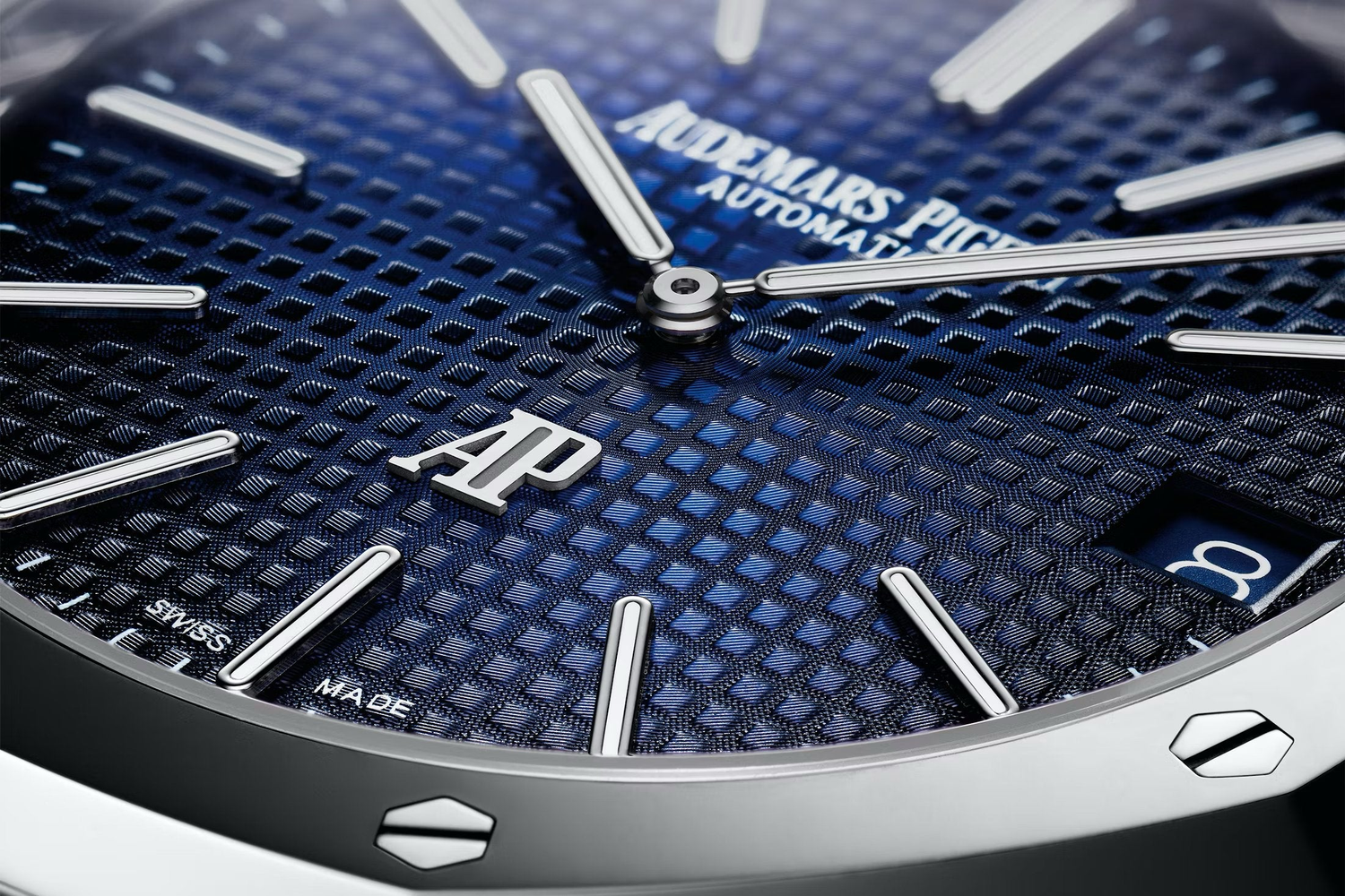 Close-up of Audemars Piguet AP logo on high-end Swiss watch dial with luxury detailing and premium finish – available at globalskydiamond.com, Diamond District NYC, 44 W 47th St Booth GF-10.