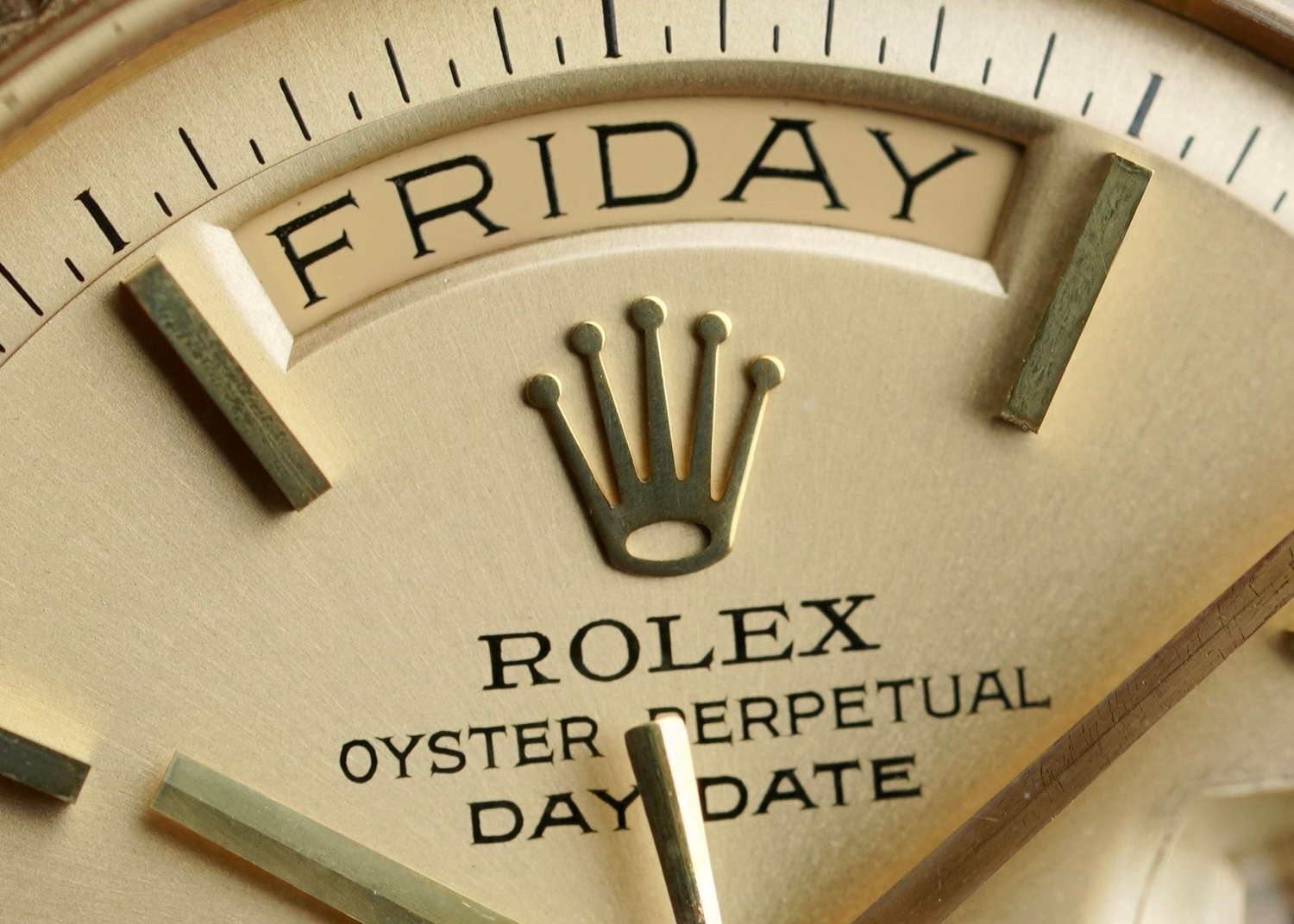 Close-up of Rolex crown logo on luxury Swiss watch dial with signature Oyster Perpetual design and premium brushed finish – available at globalskydiamond.com, Diamond District NYC, 44 W 47th St Booth GF-10.