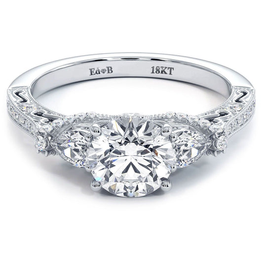 Vintage milgrain round diamond engagement ring with pear shape side stones in three-stone setting, 18KT white gold, shown in detailed studio shot. Custom bridal ring from Global Sky Diamonds, 44W 47th St Booth GF-10, Diamond District NYC. Round brilliant center diamond with pear side accents and pave shank. Website: globalskydiamond.com. Instagram @globalskydiamonds. TikTok @global.sky.diamonds. #Mazalito