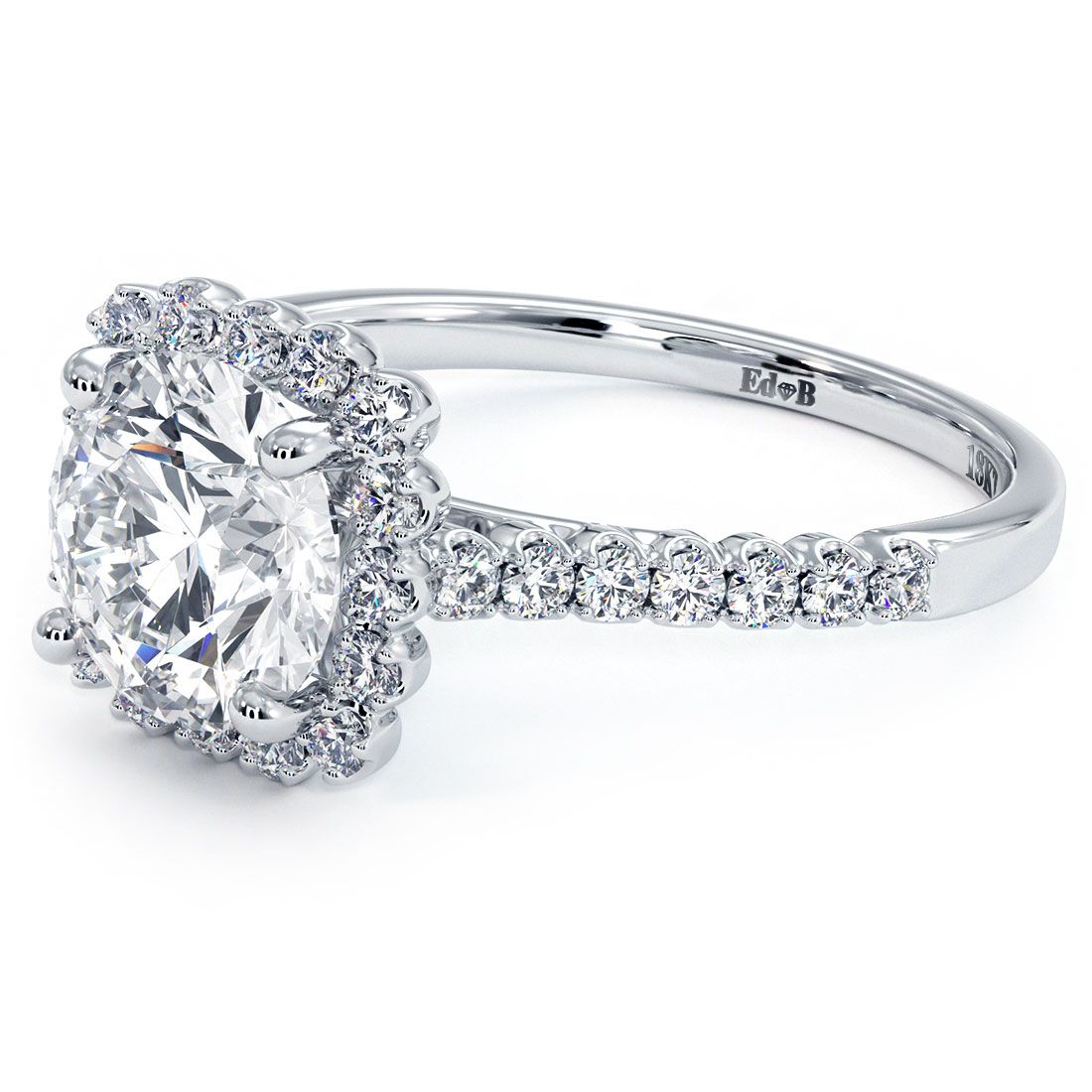 Angled close-up of round center diamond cushion halo engagement ring with brilliant side stones and twisted pavé diamond shank in 18k white gold from Global Sky Diamonds, Diamond District NYC. Explore designs at GlobalSkyDiamond.com and TikTok @global.sky.diamond.