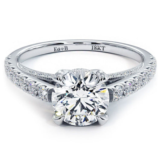 Round Brilliant diamond engagement ring setting in 18k white gold with micropavé diamonds and vintage milgrain detailing, shown from a top-down angle, designed for a 1.0ct center stone (not included), handcrafted with G color SI1 clarity side stones, photographed at Global Sky Diamonds, 44W 47th St Booth GF-10 in NYC’s Diamond District. Shop now at globalskydiamond.com. Instagram @globalskydiamonds, TikTok @global.sky.diamond.
