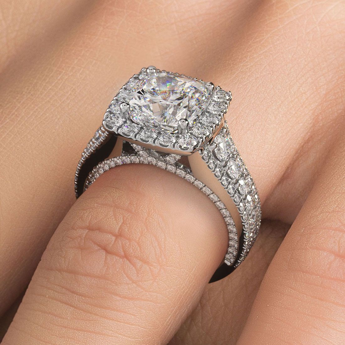Cushion halo vintage engagement ring shown on hand; 2.40ctw in 18k white gold with G color SI1 side stones, custom design from Global Sky Diamonds in NYC’s 44 W 47th St Diamond District | globalskydiamond.com