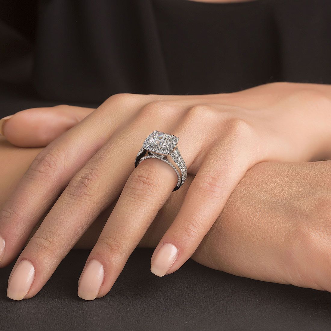 Cushion halo vintage engagement ring shown on hand; 2.40ctw in 18k white gold with G color SI1 side stones, custom design from Global Sky Diamonds in NYC’s 44 W 47th St Diamond District | globalskydiamond.com
