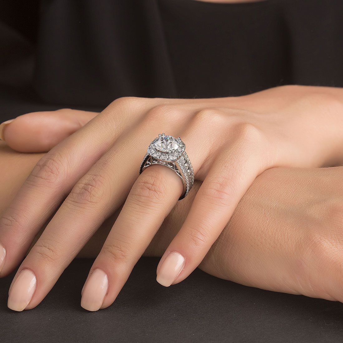 On-hand view of cushion halo engagement ring setting with vintage milgrain borders, round center diamond mount (fits 3.0ct, not included), featuring 2.75 carats of shimmering micropavé diamonds in G color SI1 clarity on an 18k white gold band — available at Global Sky Diamond, 44 W 47th St Booth GF-10, Diamond District NYC — discover more on globalskydiamond.com