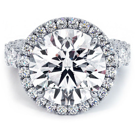 Front view of luxurious round halo diamond engagement ring setting with 3.45 carats of G color SI1 clarity micropavé diamonds and a bold U-shape shank design in high-polish 18k white gold, made to hold a 7.40ct round center stone (not included), masterfully crafted by Global Sky Diamond at 44 W 47th St Booth GF-10 in New York City’s Diamond District — shop this statement bridal ring now at globalskydiamond.com.